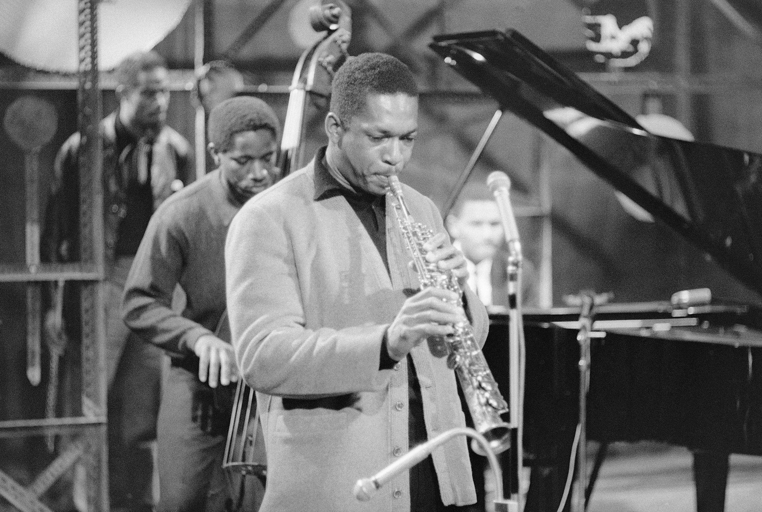 Coltrane's quintet on West German TV circa 1961, with Reggie Workman on bass, McCoy Tyner on piano, and Eric Dolphy in the back. Photo via Michael Ochs Archives/Getty Images.